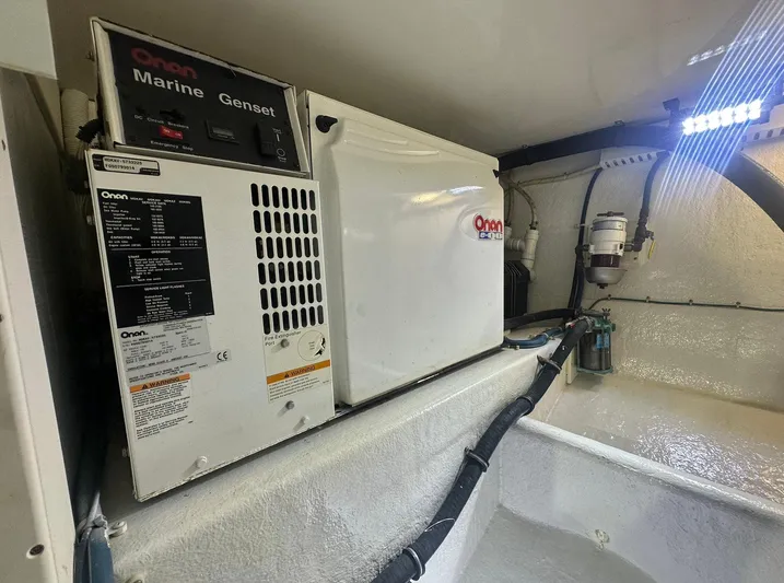 Current Addition Yacht Photos Pics Onan Marine Genset in 2006 Henriques 42 Convertible engine room.