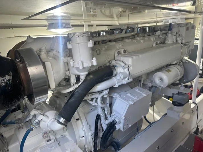 Current Addition Yacht Photos Pics Engine room of a 2006 Henriques 42 Convertible boat, showcasing detailed machinery.