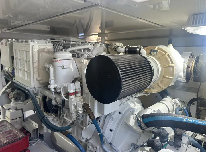 Current Addition Yacht Photos Pics Engine room of a 2006 Henriques 42 Convertible boat, showcasing detailed machinery components.