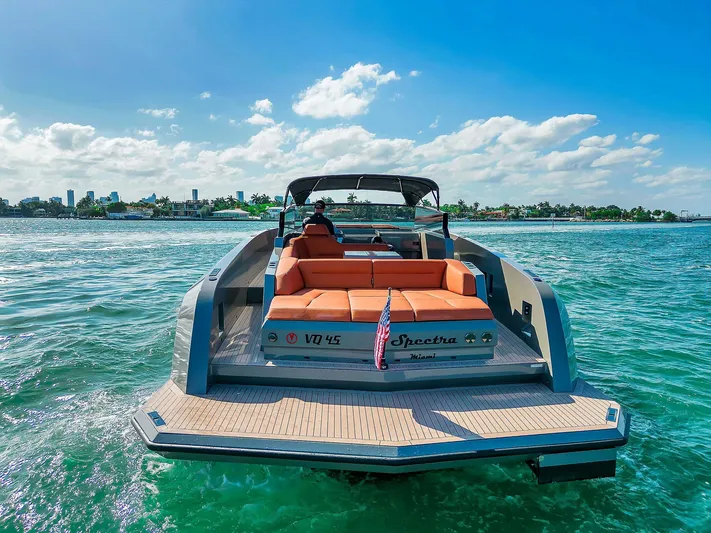 Spectra Yacht Photos Pics 2021 Vanquish Yachts VQ 45 on water, sunny day, luxury yacht cruising.