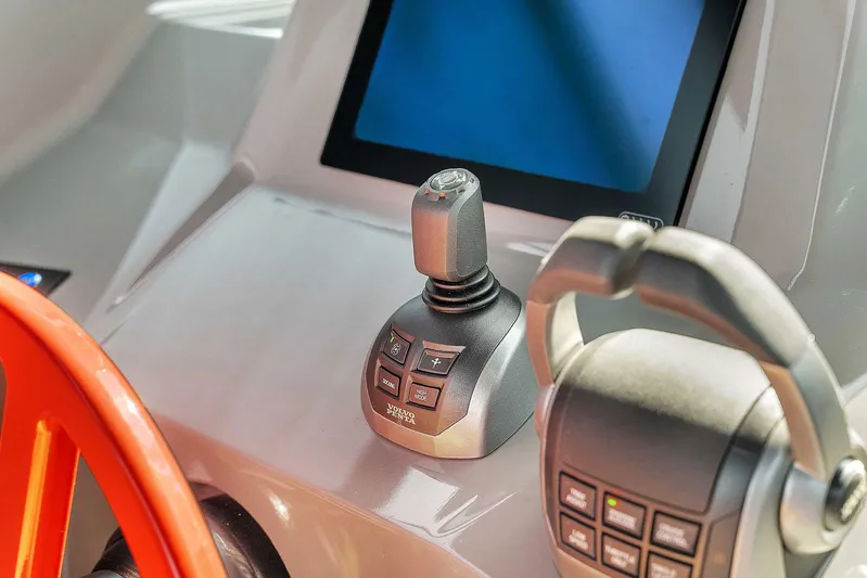 Spectra Yacht Photos Pics Control panel of 2021 Vanquish Yachts VQ 45 with joystick and screen.