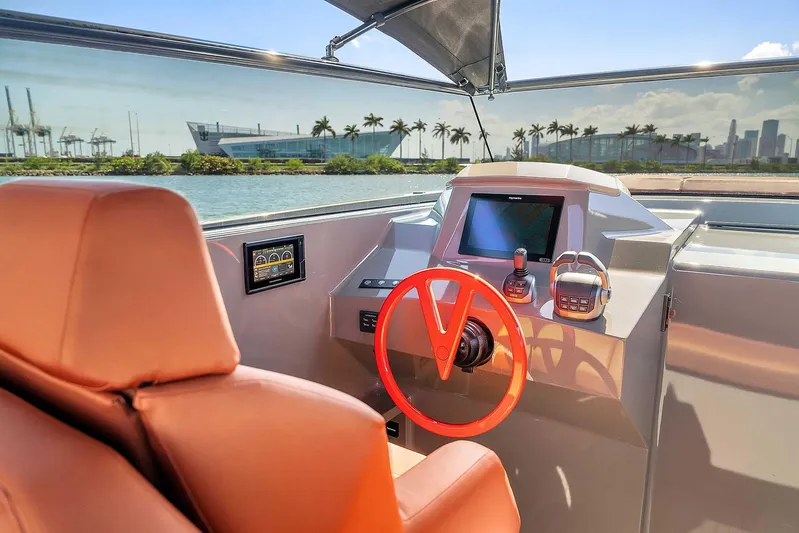 Spectra Yacht Photos Pics Interior of 2021 Vanquish Yachts VQ 45, featuring modern helm and luxurious seating.