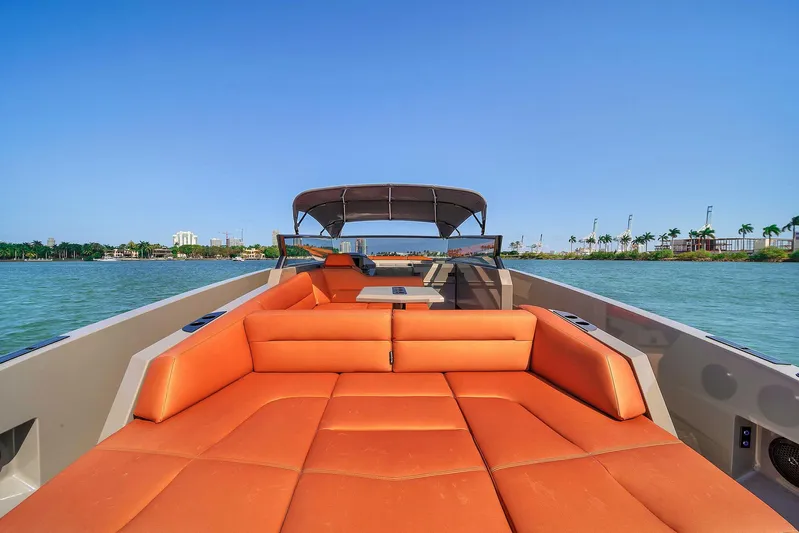 Spectra Yacht Photos Pics Vanquish Yachts VQ 45, 2021 model, featuring luxurious orange seating on open water.