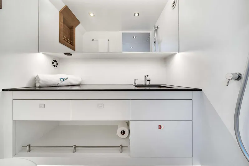 Spectra Yacht Photos Pics Luxury bathroom interior of 2021 Vanquish Yachts VQ 45, featuring sleek design and modern fixtures.