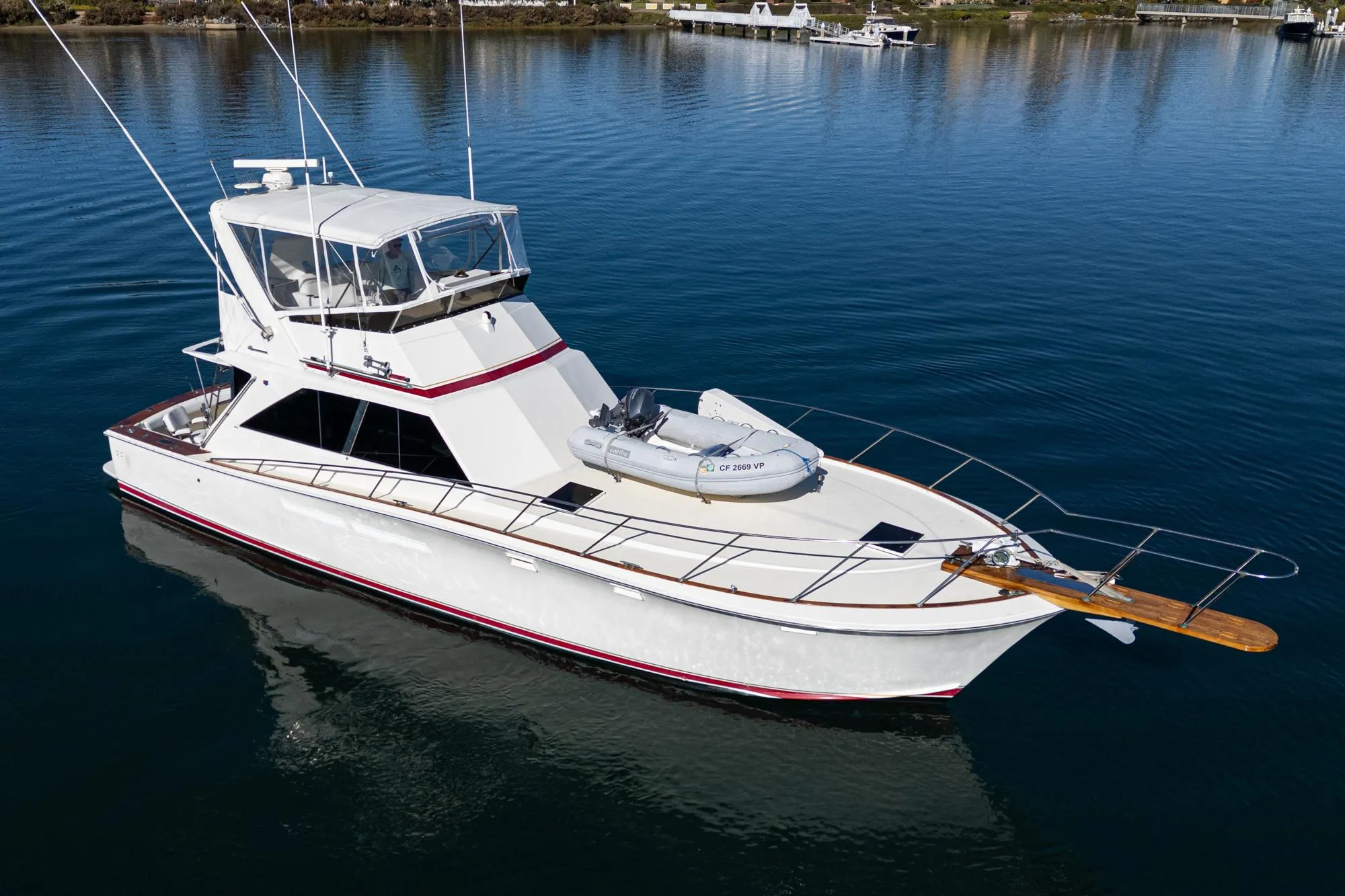 1974 Pacemaker Sportfisher yacht on calm water.