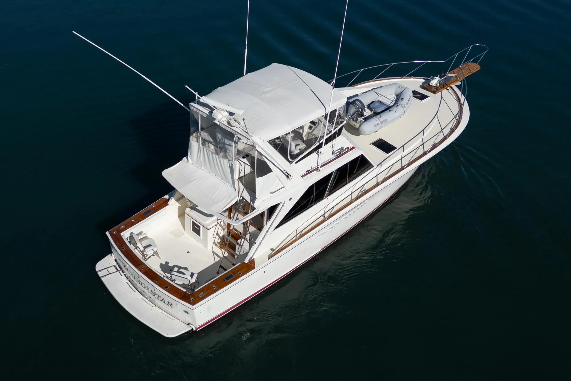 Aerial view of a 1974 Pacemaker Sportfisher yacht on calm water.