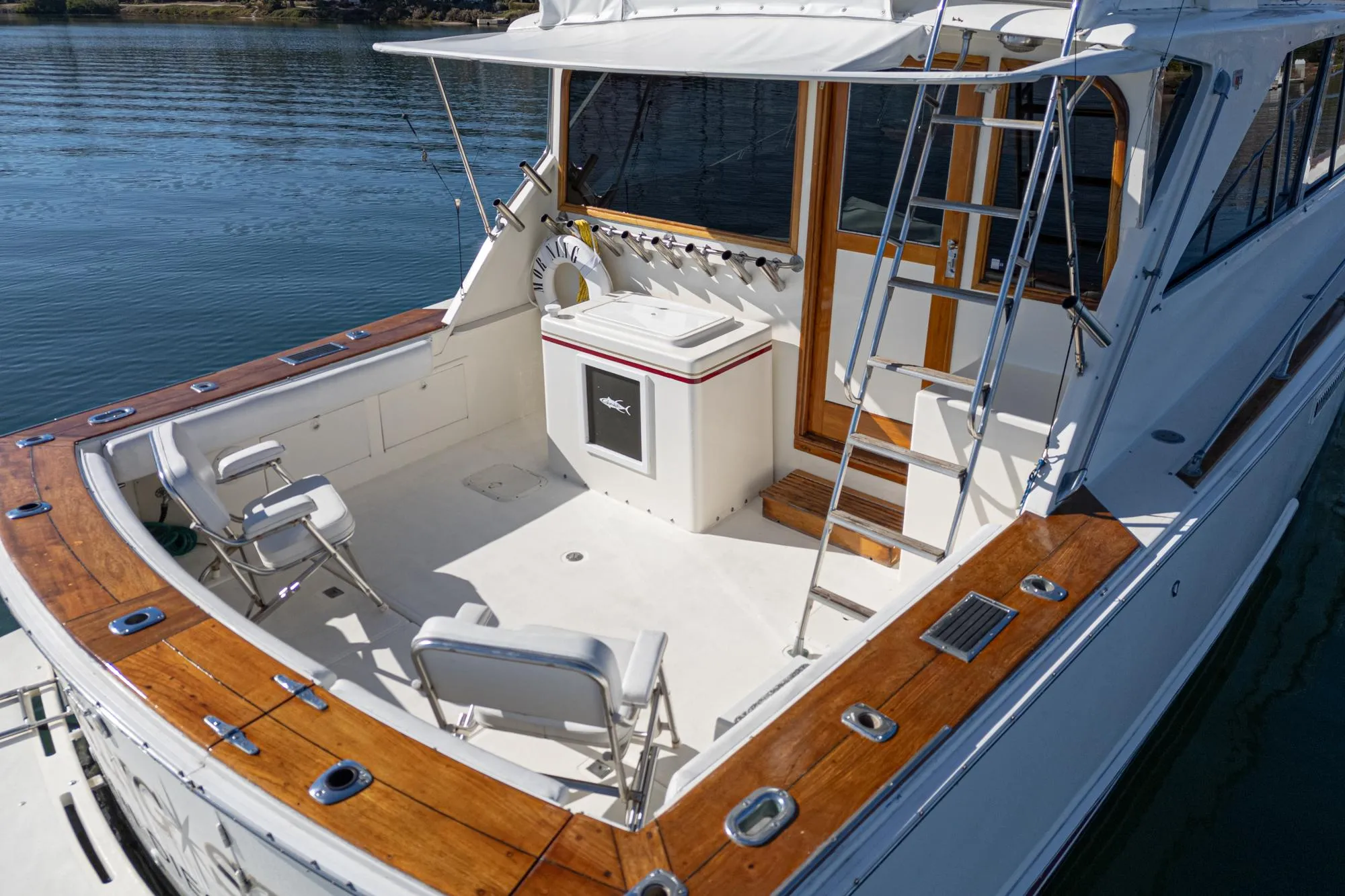 1974 Pacemaker Sportfisher with wooden trim and fishing chairs.