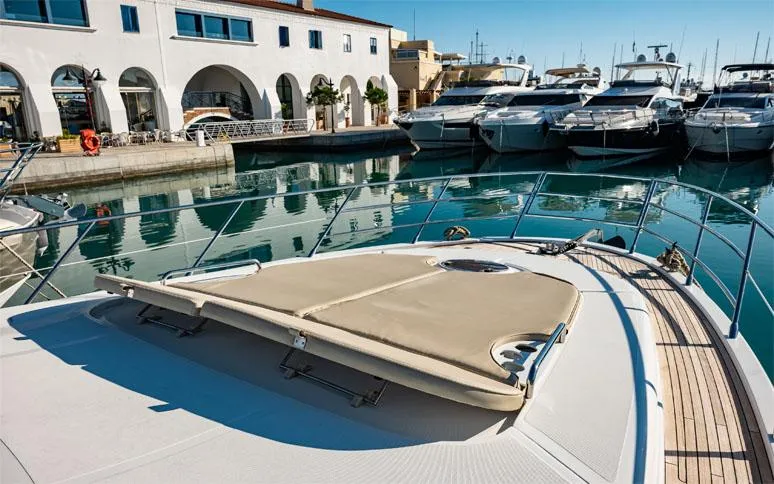  Yacht Photos Pics 2014 Azimut 64 yacht docked in a marina, featuring a spacious sun deck.