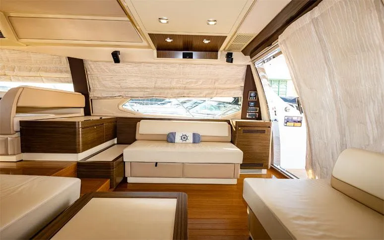  Yacht Photos Pics Luxurious interior of a 2014 Azimut 64 yacht with elegant seating and wood accents.