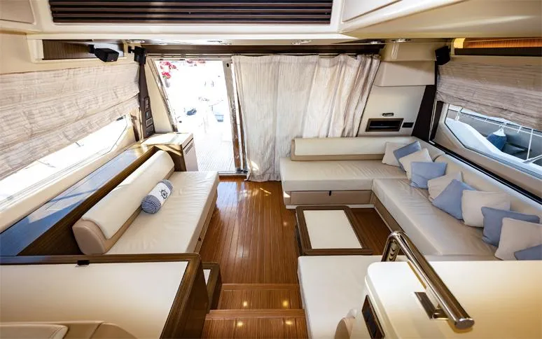  Yacht Photos Pics Luxurious interior of a 2014 Azimut 64 yacht with elegant seating and wooden flooring.
