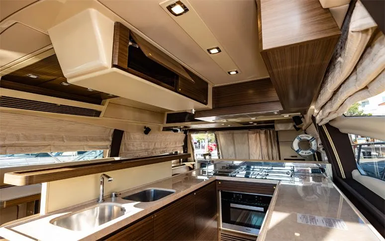  Yacht Photos Pics Luxurious interior of a 2014 Azimut 64 yacht featuring a modern kitchen design.