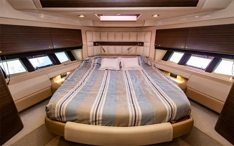  Yacht Photos Pics Luxurious bedroom interior of 2014 Azimut 64 yacht with striped bedding and modern design.