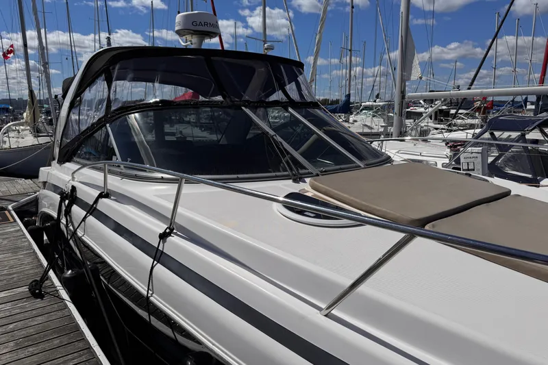  Yacht Photos Pics 2015 Regal 32 Express yacht docked at marina under clear blue sky.