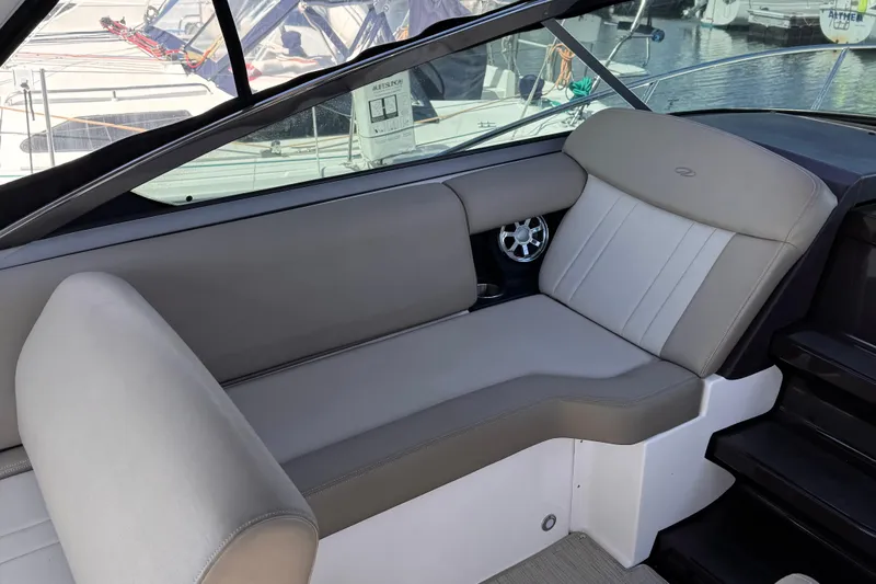  Yacht Photos Pics 2015 Regal 32 Express boat interior with gray seating and window view.