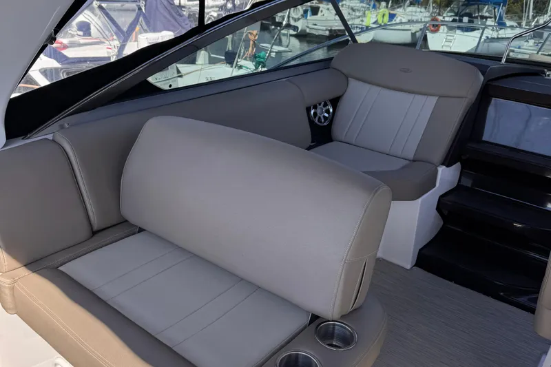  Yacht Photos Pics 2015 Regal 32 Express boat interior with comfortable seating and cup holders.