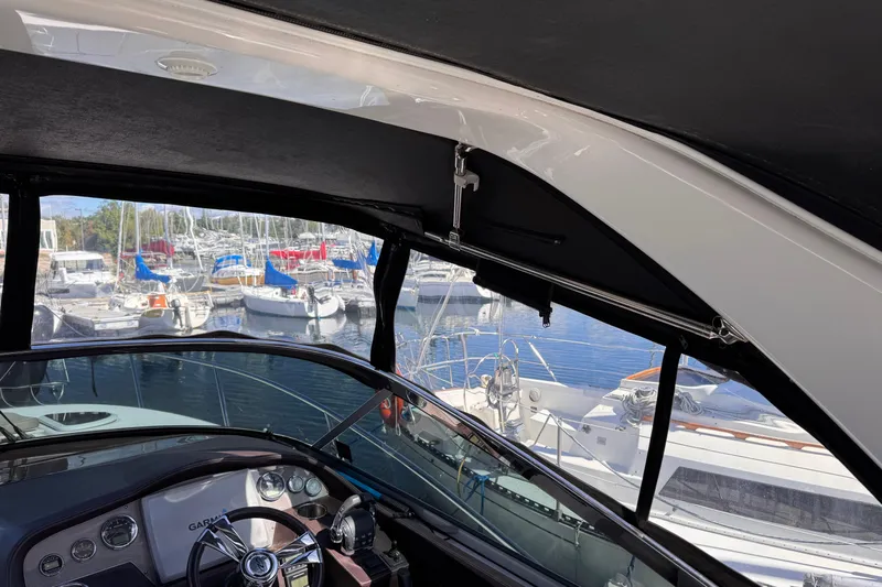  Yacht Photos Pics Interior view of 2015 Regal 32 Express boat with marina background.