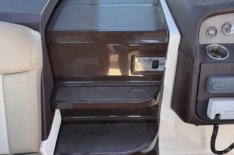  Yacht Photos Pics Interior view of 2015 Regal 32 Express boat showing steps and control panel.