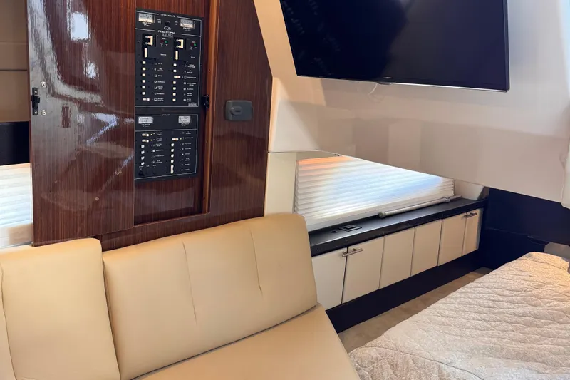  Yacht Photos Pics Interior of 2015 Regal 32 Express yacht with beige seating and control panel.