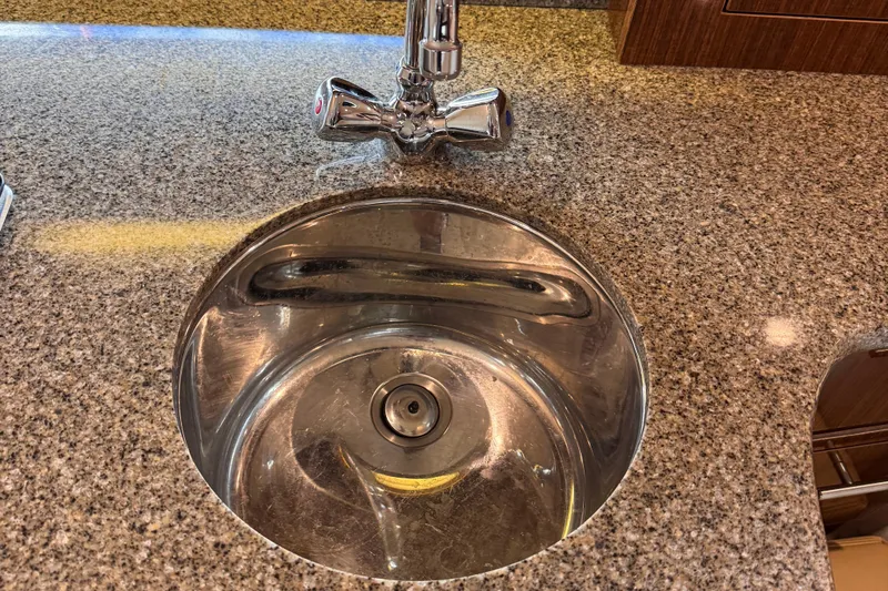 Yacht Photos Pics Stainless steel sink on granite countertop in 2015 Regal 32 Express boat kitchen.