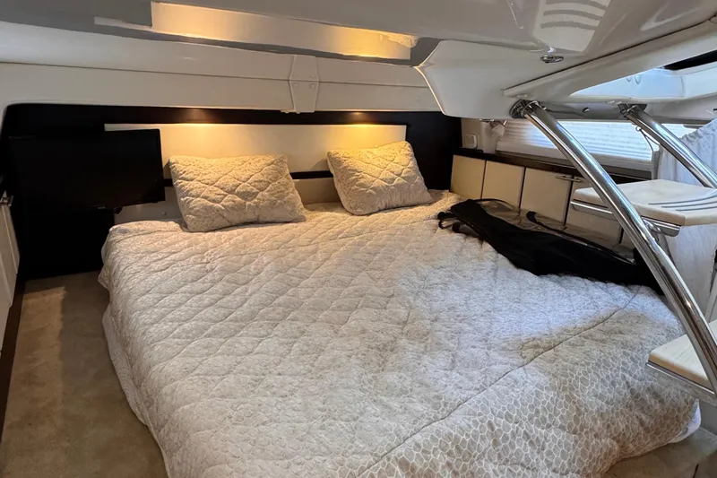  Yacht Photos Pics Luxurious cabin interior of 2015 Regal 32 Express yacht with cozy bedding.