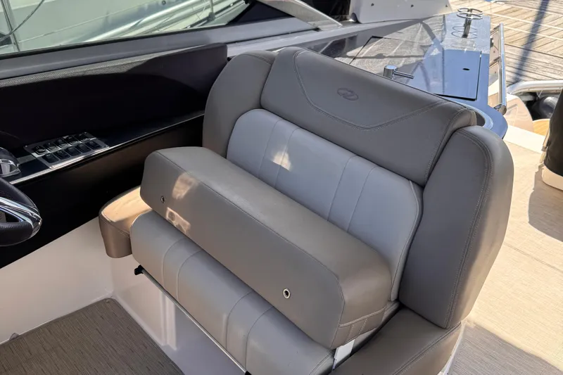  Yacht Photos Pics 2015 Regal 32 Express boat interior seating with gray upholstery.