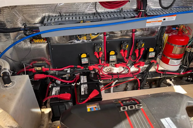 Yacht Photos Pics Engine compartment of a 2015 Regal 32 Express boat, featuring wiring and fire extinguisher.