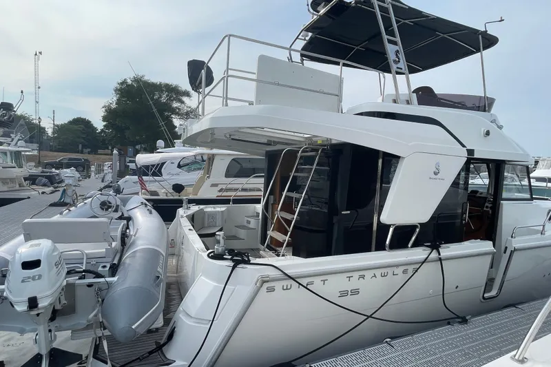 A To Z Yacht Photos Pics 2018 Beneteau Swift Trawler 35 docked, featuring sleek design and modern amenities.