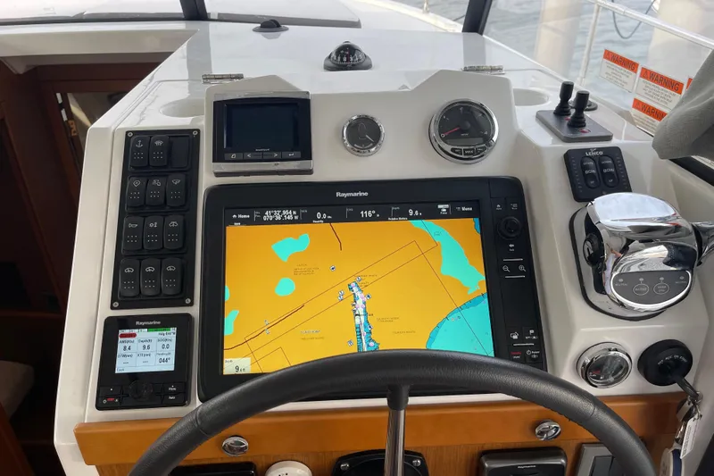 A To Z Yacht Photos Pics Beneteau Swift Trawler 35 helm with navigation display and control panel, 2018 model.