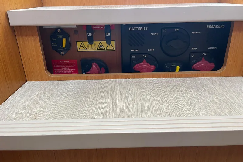 A To Z Yacht Photos Pics Electrical panel of 2018 Beneteau Swift Trawler 35, featuring battery and breaker controls.