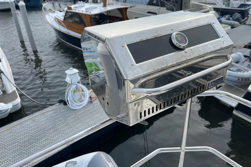 A To Z Yacht Photos Pics Stainless steel grill on a 2018 Beneteau Swift Trawler 35, docked at a marina.
