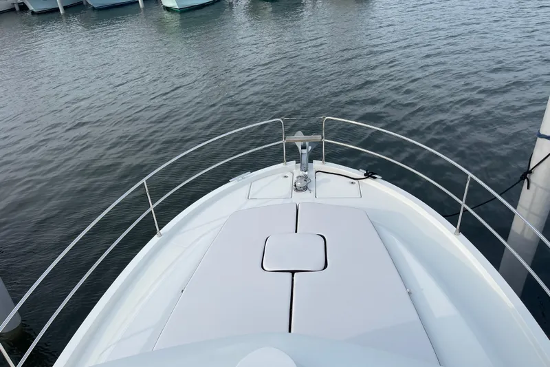 A To Z Yacht Photos Pics 2018 Beneteau Swift Trawler 35 bow view at marina, showcasing sleek design.