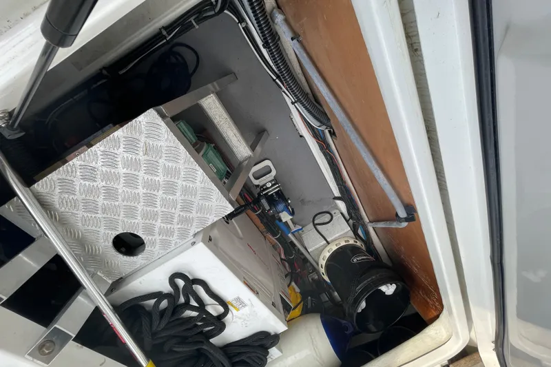 A To Z Yacht Photos Pics Interior view of 2018 Beneteau Swift Trawler 35 engine compartment with equipment and cables.