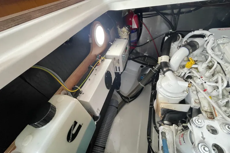 A To Z Yacht Photos Pics Engine room of 2018 Beneteau Swift Trawler 35, showcasing mechanical components and wiring.