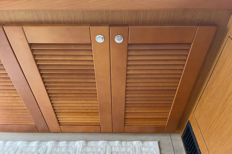 A To Z Yacht Photos Pics Wooden cabinet doors inside a 2018 Beneteau Swift Trawler 35 yacht interior.