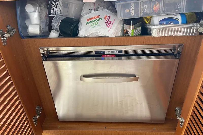 A To Z Yacht Photos Pics Stainless steel dishwasher in a 2018 Beneteau Swift Trawler 35 kitchen cabinet.