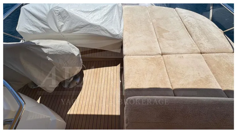  Yacht Photos Pics Luxurious deck of 2016 Absolute 64 FLY yacht with cushioned seating and covered equipment.