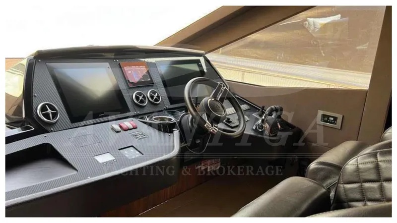  Yacht Photos Pics Helm of 2016 Absolute 64 FLY yacht with modern controls and leather seating.