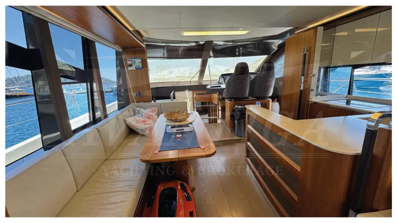  Yacht Photos Pics Luxurious interior of 2016 Absolute 64 FLY yacht with elegant seating and helm station.