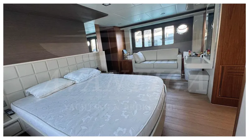  Yacht Photos Pics Luxurious bedroom interior on 2016 Absolute 64 FLY yacht with bed and sofa.