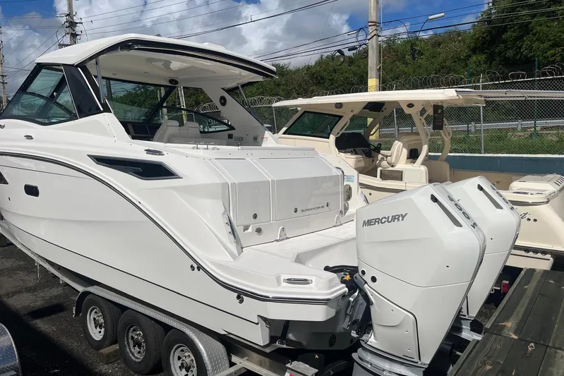  Yacht Photos Pics 2026 Sea Ray Sundancer 320 Outboard with Mercury engines on a trailer.