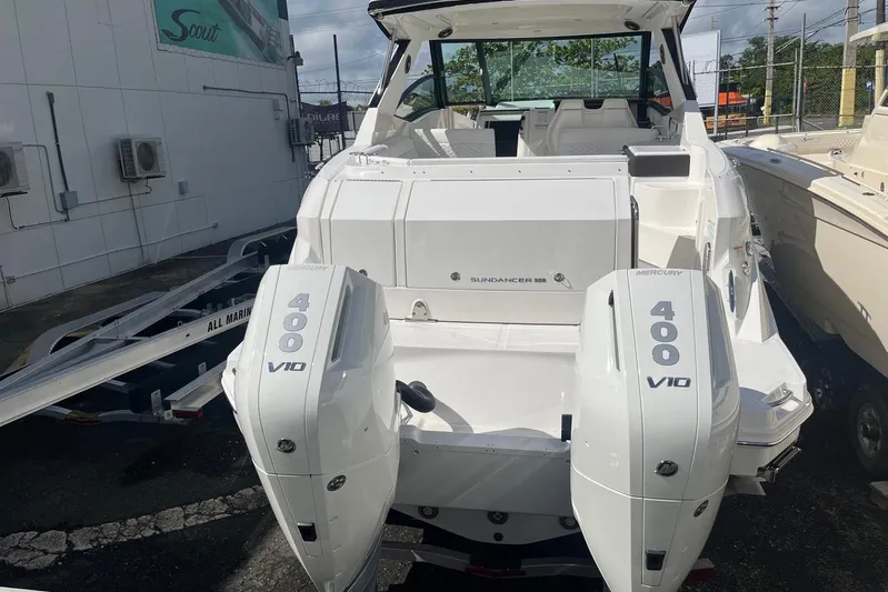  Yacht Photos Pics 2026 Sea Ray Sundancer 320 Outboard with twin Mercury 400 V10 engines, docked outdoors.