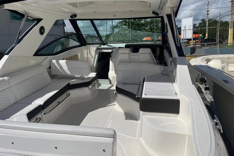  Yacht Photos Pics 2026 Sea Ray Sundancer 320 Outboard interior with luxurious seating and modern design.