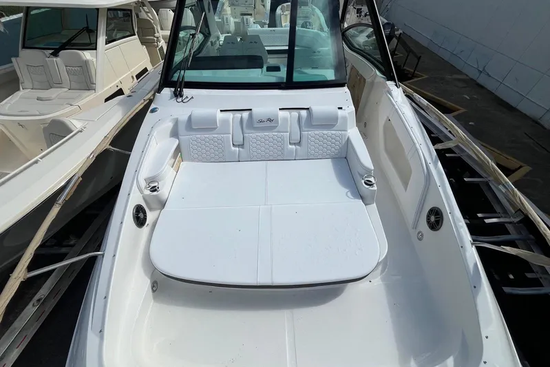  Yacht Photos Pics 2026 Sea Ray Sundancer 320 Outboard boat interior with white seating and modern design.