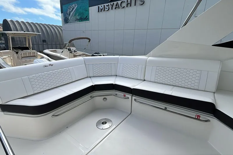  Yacht Photos Pics 2026 Sea Ray Sundancer 320 Outboard, luxurious white seating area on a yacht.