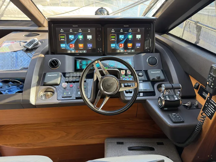  Yacht Photos Pics Helm of 2016 Princess 68 yacht with dual displays and modern controls.