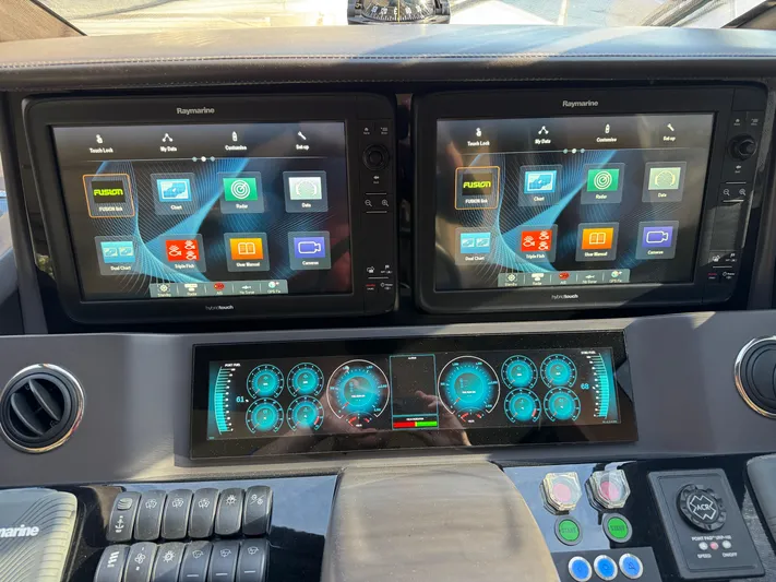  Yacht Photos Pics Control panel of a 2016 Princess 68 yacht with dual Raymarine displays.