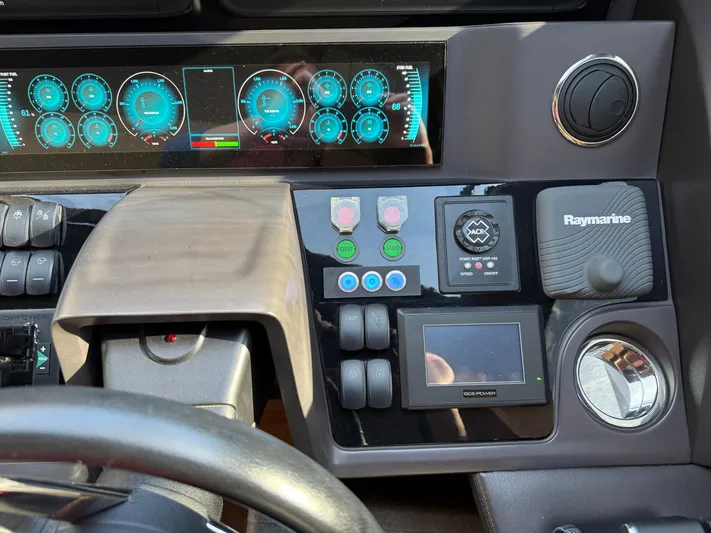  Yacht Photos Pics Control panel of a 2016 Princess 68 yacht with digital displays and navigation equipment.