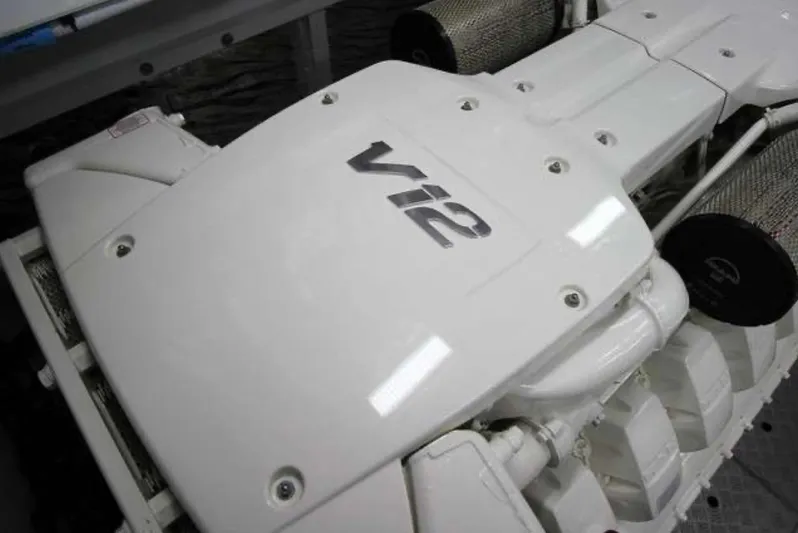  Yacht Photos Pics V12 engine of a 2016 Princess 68 yacht, showcasing sleek white design.