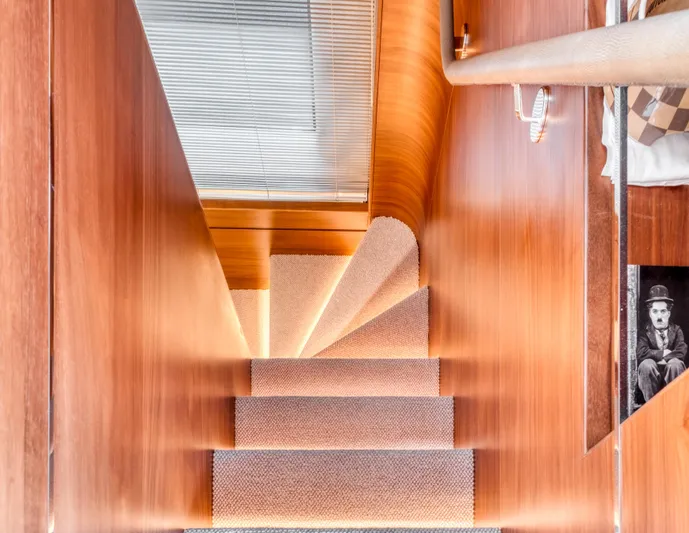 Yacht Photos Pics Wooden staircase with carpeted steps inside a 2016 Princess 68 yacht.