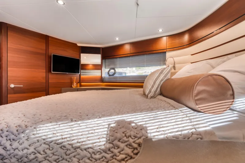  Yacht Photos Pics Luxurious bedroom interior of 2016 Princess 68 yacht with modern design and cozy bedding.